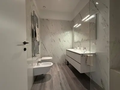 a white bathroom with a sink and a mirror at Casa di Mara by Valentina's Dream in Rome