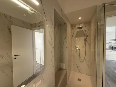 a bathroom with a shower with a glass door at Casa di Mara by Valentina's Dream in Rome