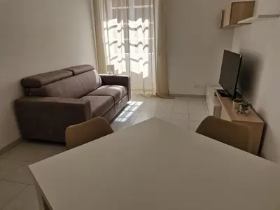 a living room with a couch and a table at Alessandro's Home in Rome