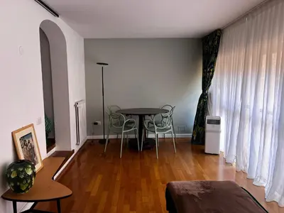 a living room with a table and chairs at Stay by the Pantheon in the Heart of Historic Rome in Rome