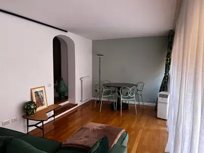 a living room with a couch and a table at Stay by the Pantheon in the Heart of Historic Rome in Rome