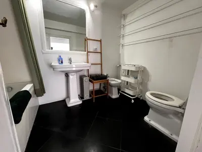 a white bathroom with a sink and a toilet at Stay by the Pantheon in the Heart of Historic Rome in Rome