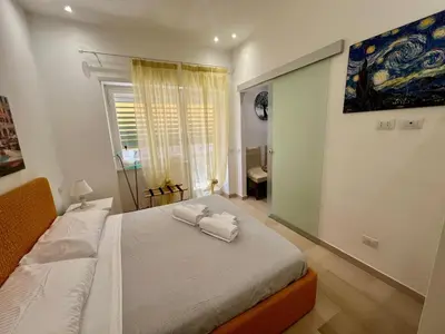 a bedroom with a bed with two towels on it at Il Pianoforte di Teresa - appartamento a Monteverde in Rome