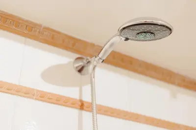a shower head on a ceiling with a hose at The Oasis of Trastevere in Rome