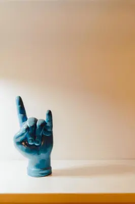 a blue hand holding up a peace sign at The Oasis of Trastevere in Rome