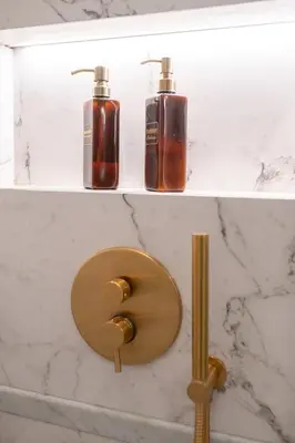 a bathroom with two bottles of soap on a wall at Lary's - San Pietro in Rome