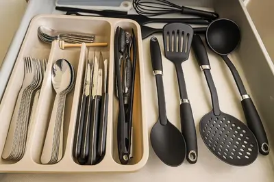 a tray full of utensils sitting on a table at Casa Chanel in Rome