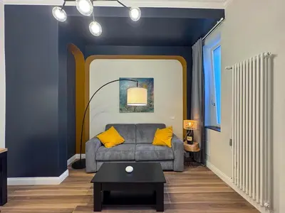 a living room with a gray couch and yellow pillows at Wine Stay, relaxation and style in Rome in Rome