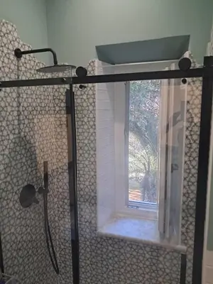 a shower with a window in a bathroom at Trastevere St Rolli 15 in Rome