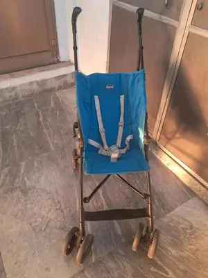 a blue wheelchair sitting on the floor next to a door at Trastevere St Rolli 15 in Rome