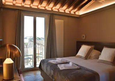 a bedroom with a bed and a large window at Spanish Steps - Luma Suite - Terraces & Rome View in Rome
