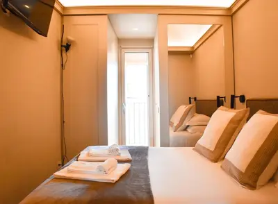 a room with a bed with two folded towels on it at Spanish Steps - Luma Suite - Terraces & Rome View in Rome