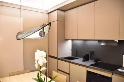 a small kitchen with a table and a sink at Spanish Steps - Luma Suite - Terraces & Rome View in Rome