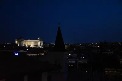 a view of a city at night with a building at Spanish Steps - Luma Suite - Terraces & Rome View in Rome