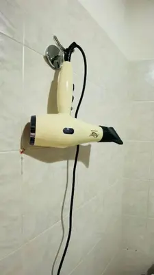 a toothbrush holder on a wall in a bathroom at Always Home in Rome