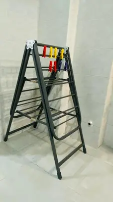 a metal stand with different colored markers on it at Always Home in Rome