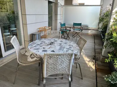 a table and chairs sitting on a patio at Clio Apartment in Rome