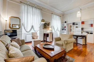 a living room with a couch and chairs and a table at Trastevere Liberty House in Rome