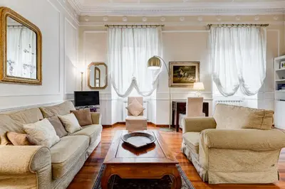 a living room with two couches and a coffee table at Trastevere Liberty House in Rome