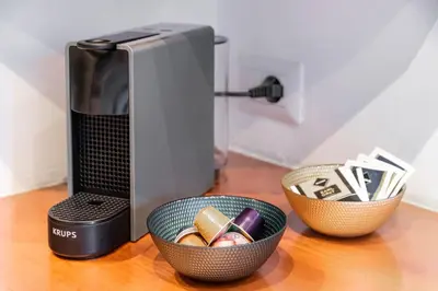 a coffee maker and two bowls on a table at Vatican Museums Apartment with Romantic Terrace in Rome