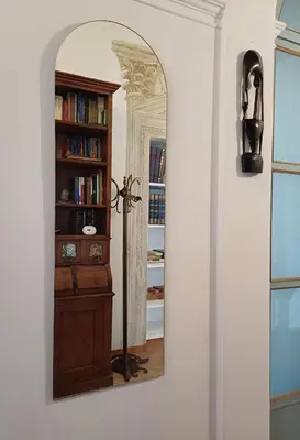 a room with a mirror and a book shelf at Del Cinque Heritage - Charme Holidays in Rome