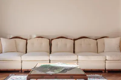a living room with white couches and a coffee table at iFlat Vintage Retreat - Comfort in Central Rome in Rome