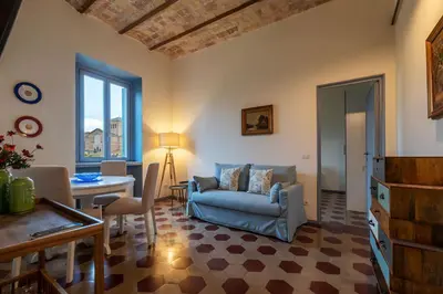 a living room with a couch and a table at GuestHost - Elegant Apartment Testaccio Roma in Rome