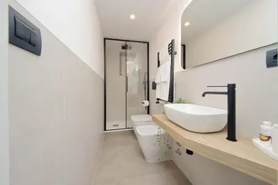 a bathroom with a sink and a toilet at Maison Florienne in Rome