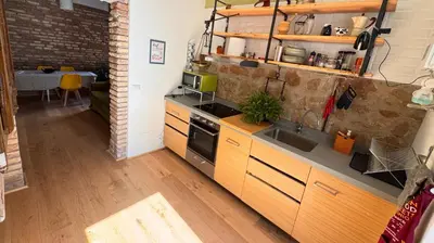 a kitchen with a sink and a stove top oven at Quiet Loft Monteverde Roma in Rome