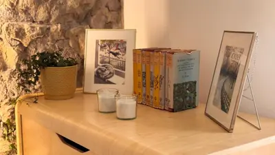 a table with two books and two glasses of milk at Quiet Loft Monteverde Roma in Rome