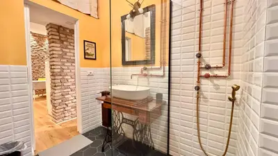 a bathroom with a sink and a mirror at Quiet Loft Monteverde Roma in Rome