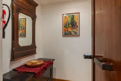 a room with a mirror and a table with a bowl on it at GuestHost - Comfy Apartment Garbatella Roma in Rome