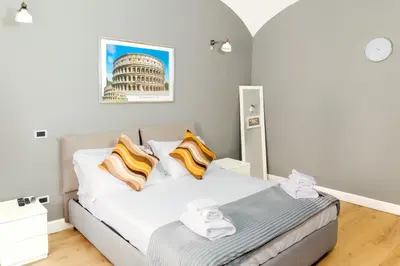 a bedroom with a bed and a building at Key Apartment Obelisco in Rome