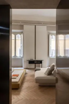 a living room with a bed and a desk at Hotel Trame in Rome