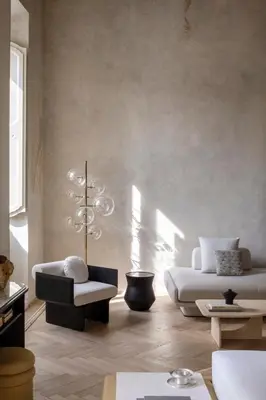 a living room with two beds and a chair at Hotel Trame in Rome