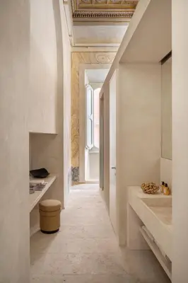 a room with a hallway with white walls and a ceiling at Hotel Trame in Rome