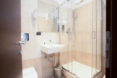 a bathroom with a sink and a shower at Rometobe in Rome
