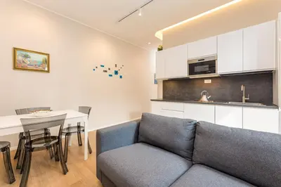 a living room with a couch and a table at La terrazza al Cupolone in Rome