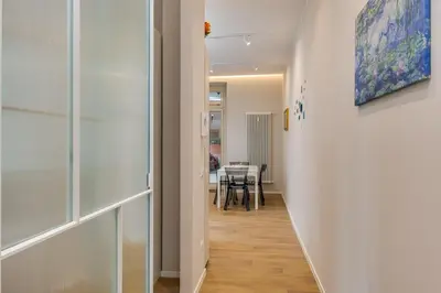 a hallway leading to a dining room with a table at La terrazza al Cupolone in Rome