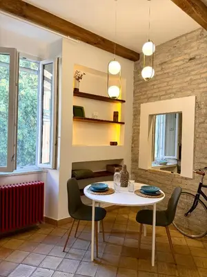 a dining room with a white table and chairs at Salotto34 in Rome