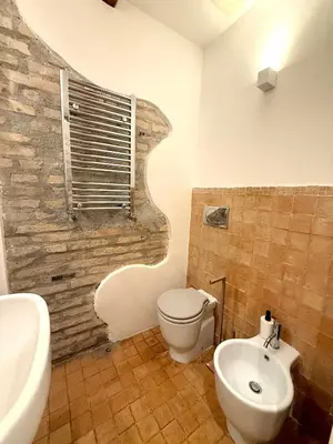 a bathroom with a toilet and a sink at Salotto34 in Rome