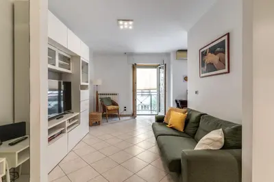 a living room with a couch and a television at Lovely flat near Vaticano in Rome