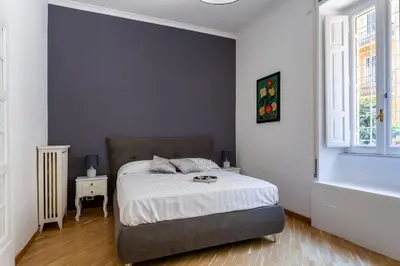 a bedroom with a bed and a window at Residenza Prati in Rome