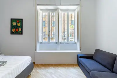 a living room with a couch and a window at Residenza Prati in Rome