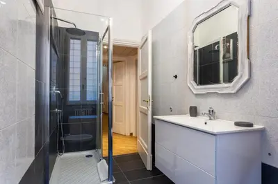 a bathroom with a shower and a sink and a mirror at Residenza Prati in Rome