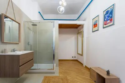 a bathroom with a shower and a sink and a mirror at Residenza Prati in Rome
