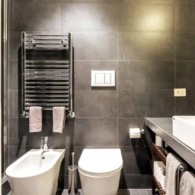 a bathroom with a toilet and a sink at Monastery's View Home in Rome