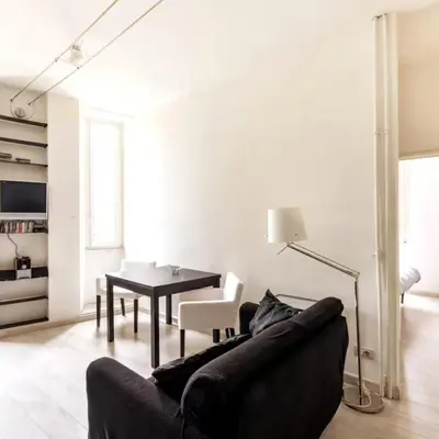 a living room with a couch and a table at Monastery's View Home in Rome
