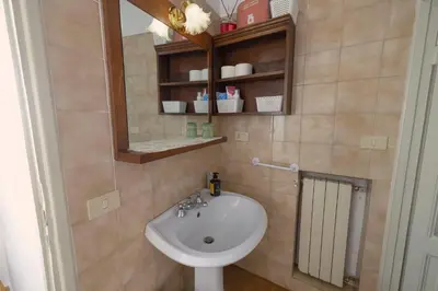 a bathroom with a sink and a mirror at Casa Mirella near Piazza Navona, Rooftop Views in Rome