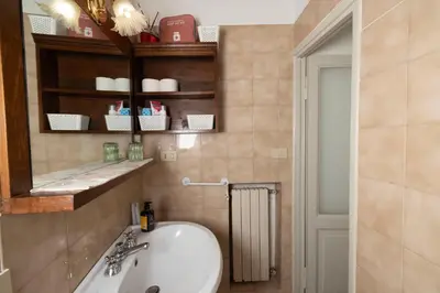 a bathroom with a sink and a mirror at Casa Mirella near Piazza Navona, Rooftop Views in Rome